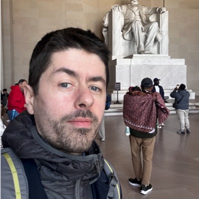 Guy Lyons standing inside the Lincoln Memorial.